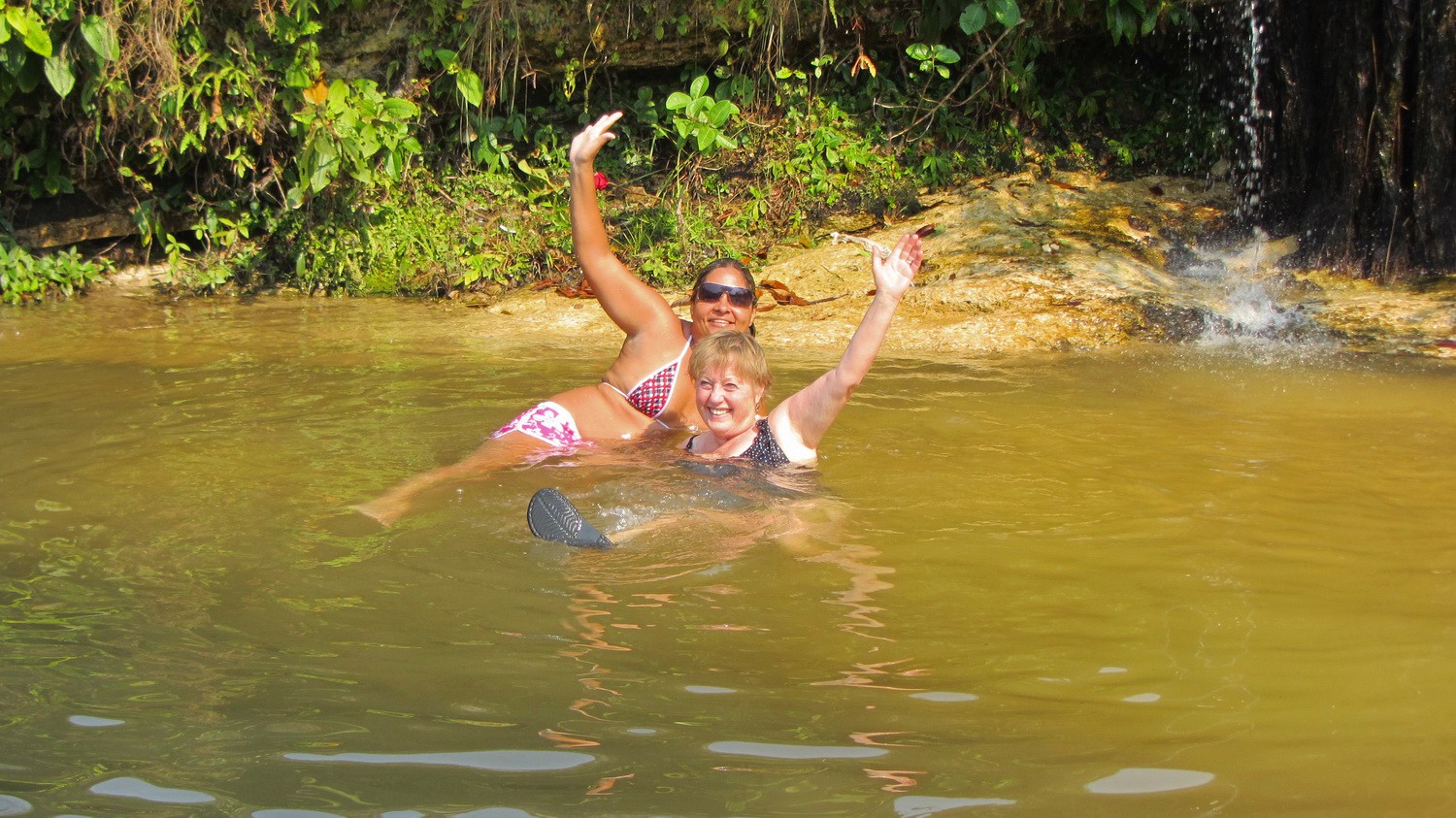 Brazilian and German girl enjoying the fresh water of the Parque Nacional da Chapada dos Guimaraes